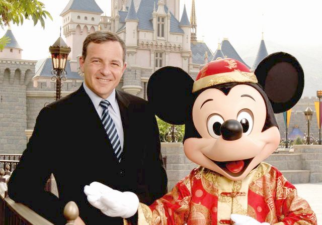 HONG KONG - JULY 19: In this previously unreleased handout photo Bob Iger, president, chief operating officer and chief executive officer-elect of The Walt Disney Company, joins Mickey Mouse in front of Sleeping Beauty Castle July 19, 2005 at the Hong Kong Disneyland Park. Hong Kong Disneyland Resort, Disney's first theme park in China, will open Sept. 12, 2005. (Photo by David Roark/WDW via Getty Images)