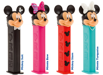 Four candy dispensers with plastic mouse heads.
