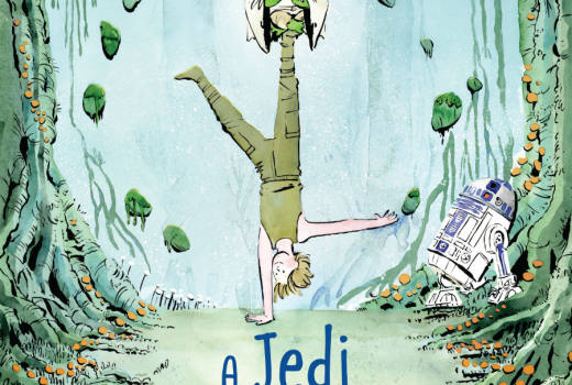 A young man does a handstand, with a green creature on his upside-down foot.