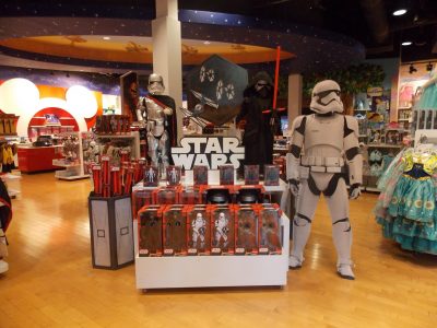 Store interior showing a display of Star Wars merchandise including a mannequin as a Stormtrooper.