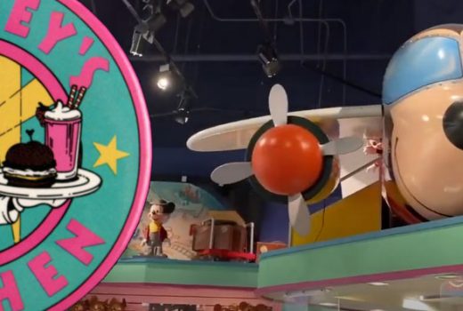 A logo of Mickey as a waiter and chef, and a photo of a plane that looks like Mickey.