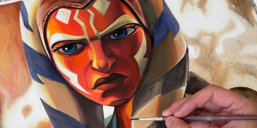 A painting of Ahsoka Tano, who has an orange face, and white and blue side piece.