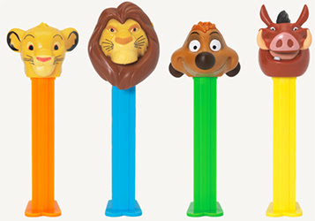 Four candy dispensers, each with coloured sticks and The Lion King character heads on top.