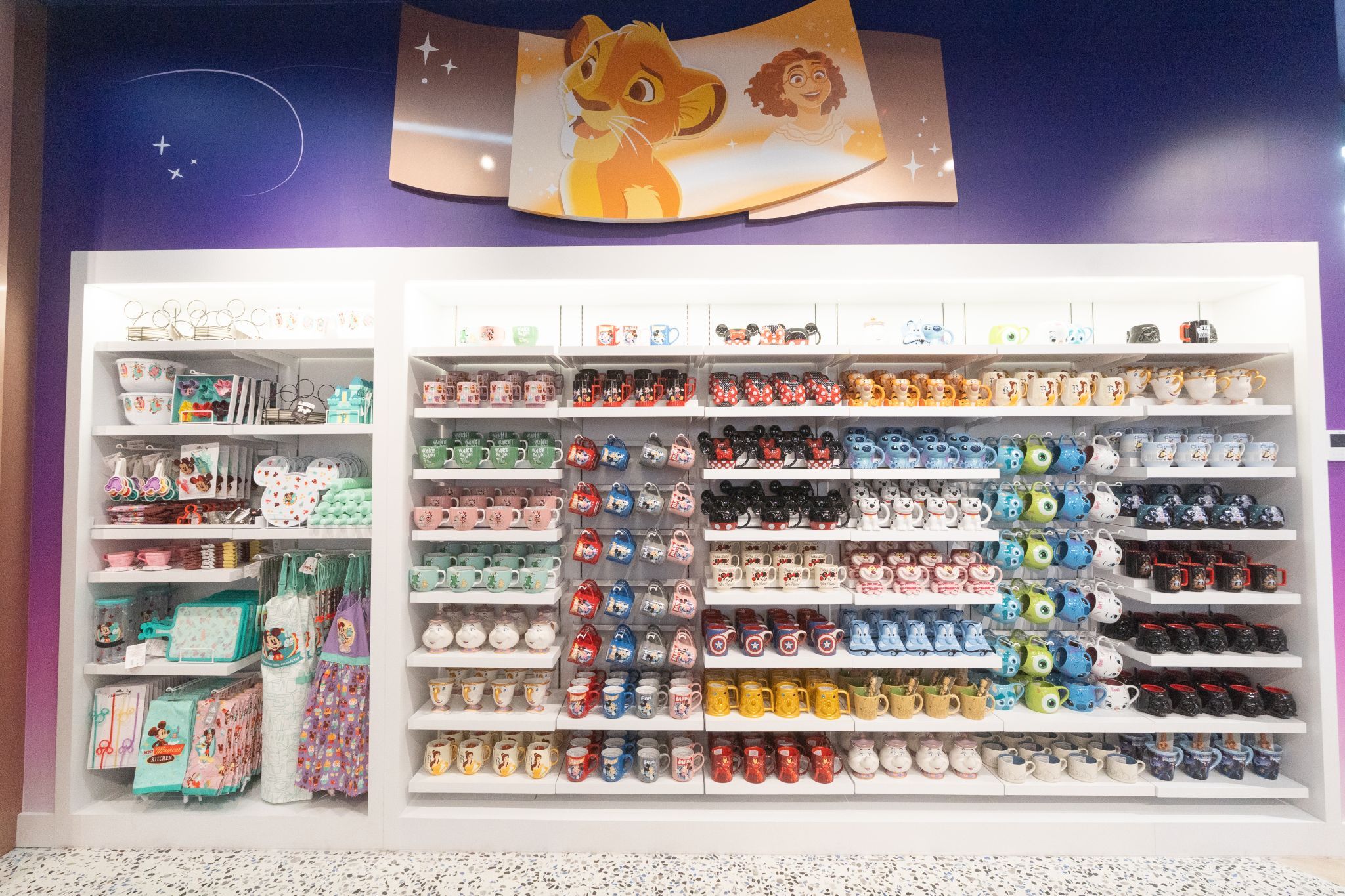 A display showing kitchenwares on the left, and mugs on the right.
