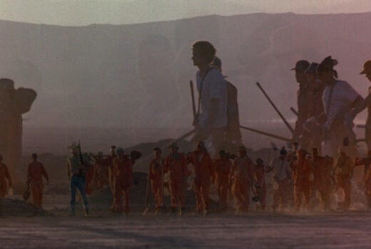 Overlapping images of boys trudging through the desert.