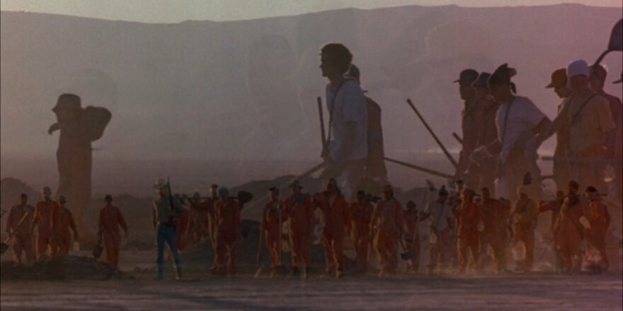 Overlapping images of boys trudging through the desert.