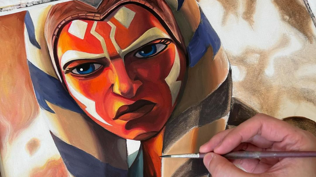 A painting of Ahsoka Tano, who has an orange face, and white and blue side piece.