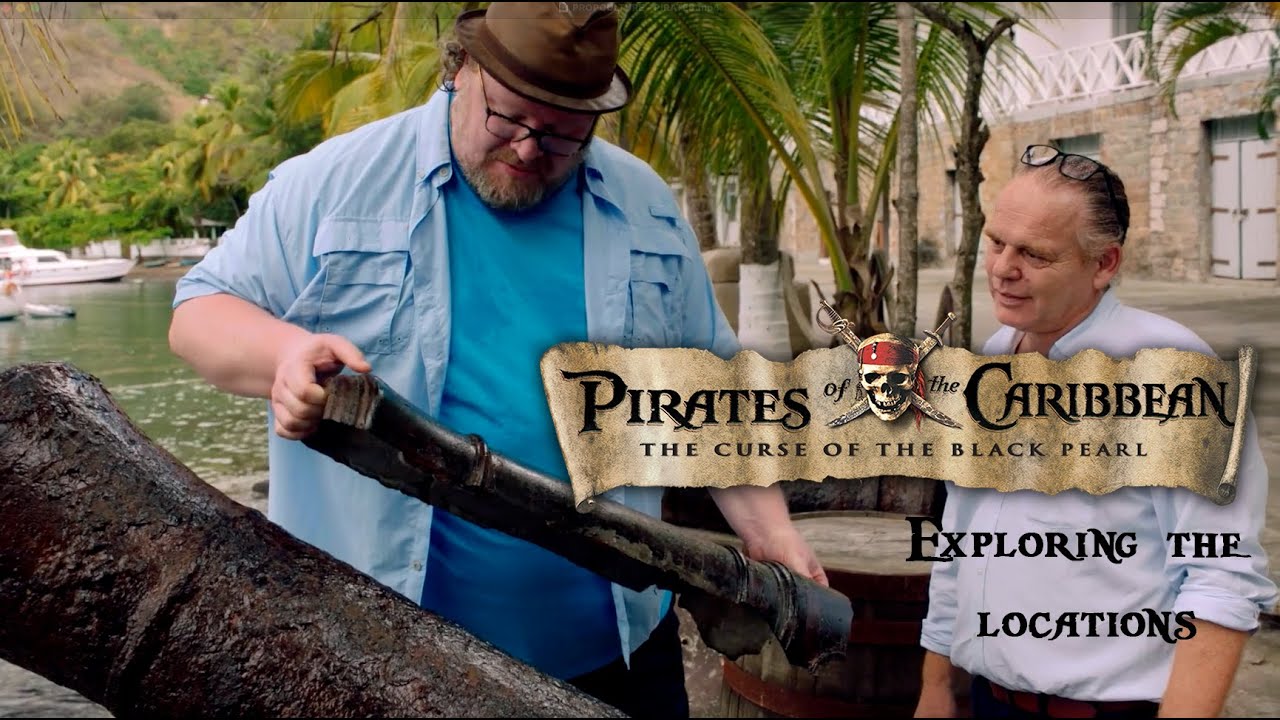 A man looks at a prop cannon.