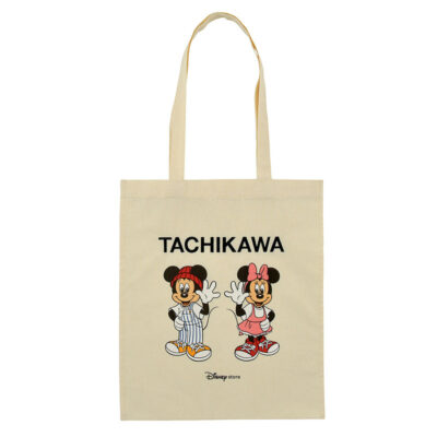 A bag showing the word Tachikawa, with Mickey and Minnie, where Mickey is wearing a toque.