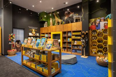 A shallow area of a room, showing tall shelves of animal related products.