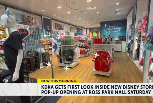 Interior of a store, with television captioning below.