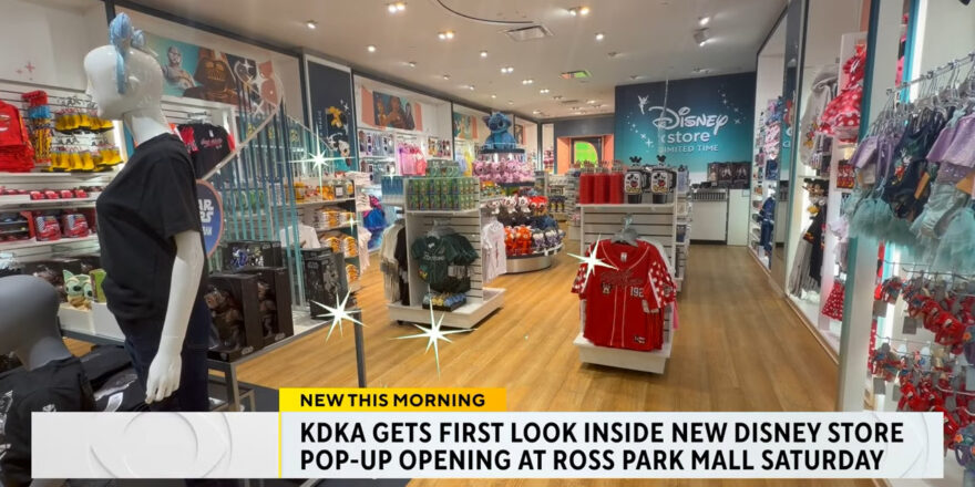 Interior of a store, with television captioning below.