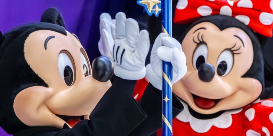 Costumed characters of Mickey Mouse and Minnie Mouse.