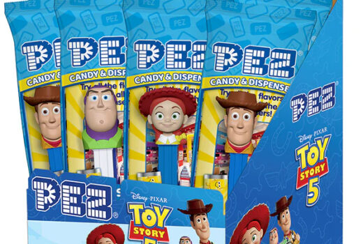 Small, tall bags hold candy dispensers with heads of cartoon characters.