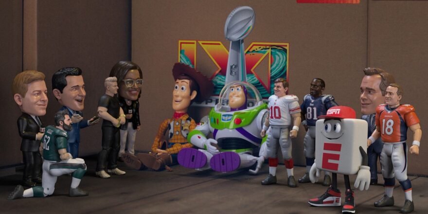 Animated characters meant to look like action figures of ESPN hosts surround Buzz and Woody in the back of a van.