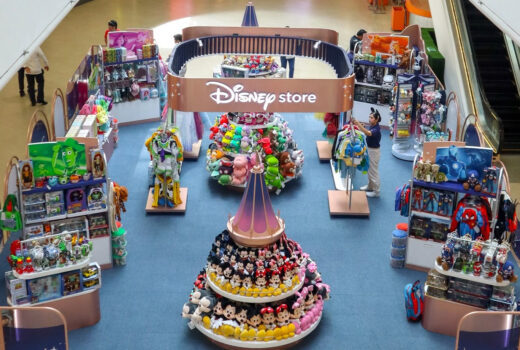 Overhead view of a display in the middle of a mall, including an arch labelled Disney Store.