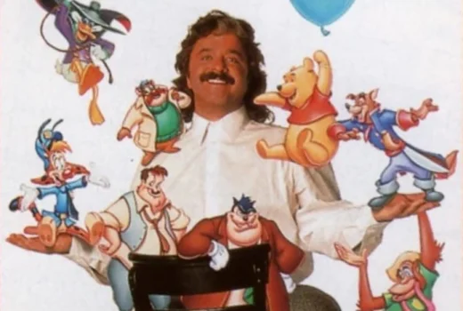 A man sits on a chair, surrounded by cartoon characters.
