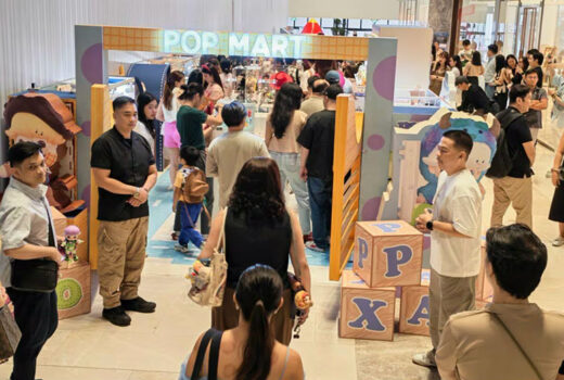 Raised view of a pop-up shop. The entrance has a blue and purple pattern referencing Sully.