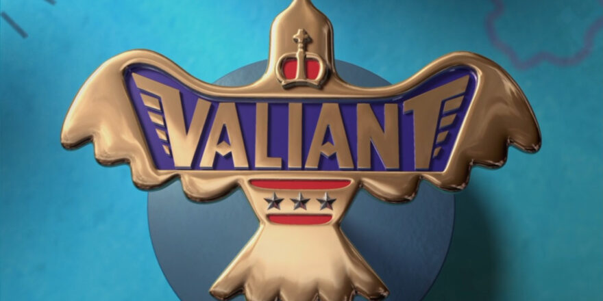 A metal pin-like item, reading Valiant. It shows a crown, wings, stars.