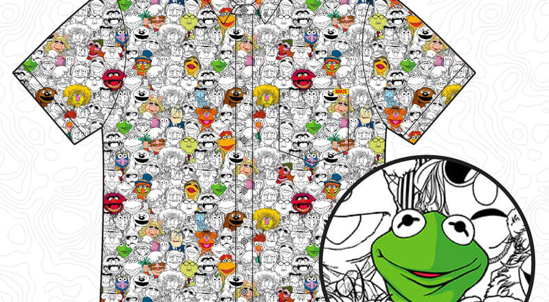A collared shirt with cartoon faces as a pattern. Muppet characters appear. In a circle, Kermit the Frog is enlarged.