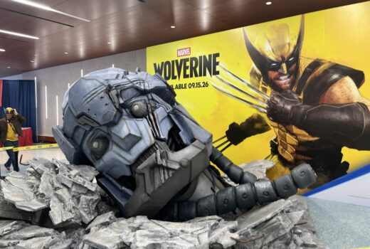 A giant robotic head, cratered into the ground.