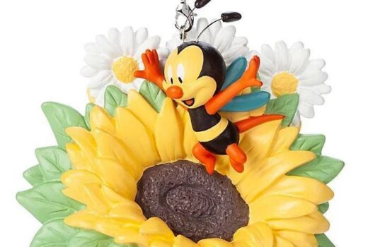 An ornament of a bee and a sunflower.